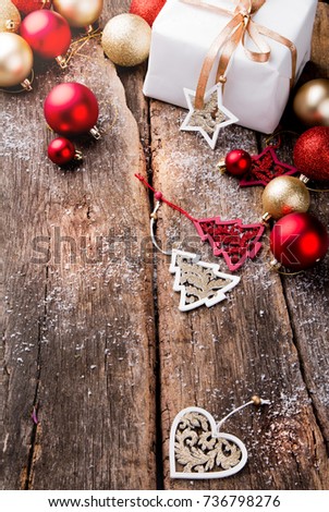 Christmas decoration on wooden background with free space. Celebration balls and other decoration. Christmas concept
