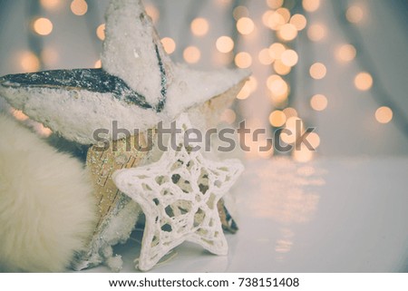 Shiny christmas ornament on white background and christmas lights.