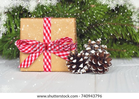 Christmas gift box. Christmas present in gift box at white wooden table. Copy space.