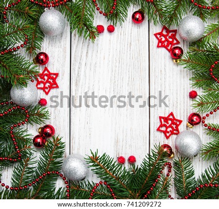 Christmas holiday background - tree and decorations on a wooden table