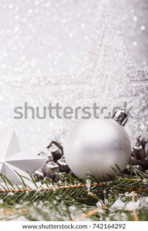 Christmas composition of Christmas tree toys on a silver background.