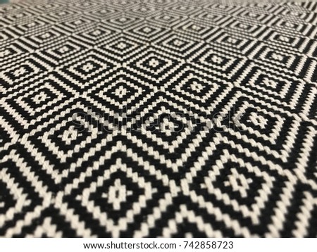 Black and white fabric diamonds on a runner