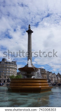Photo from iconic Nelson's column in Trafalgar square on a cloudy blue sky, London, United Kingdom             