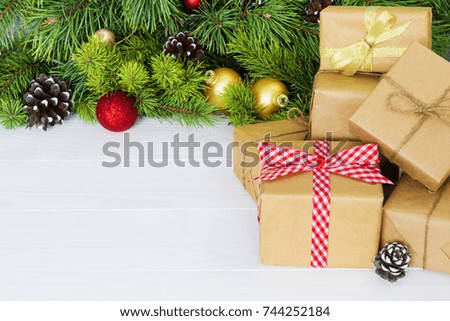 Christmas gift boxes. Christmas present in gift boxes at white wooden table. Copy space.