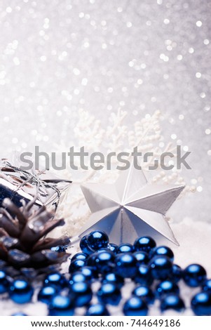 Christmas composition of Christmas tree toys on a silver background.
