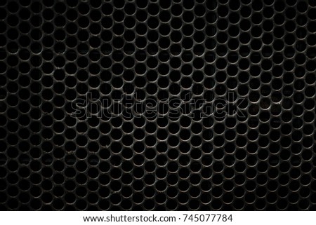 Black metal texture background.
perforated metal texture with circle mesh