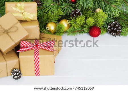 Christmas gift boxes. Christmas present in gift boxes at white wooden table. Copy space.