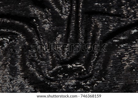 rectangular shiny black fabric with sequins, festive background