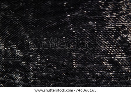 rectangular shiny black fabric with sequins, festive background