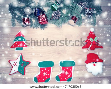 christmas background and decoration with fir branches snow on wooden board