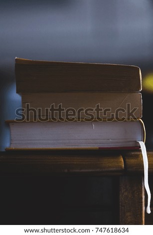 Education books on the wooden table background