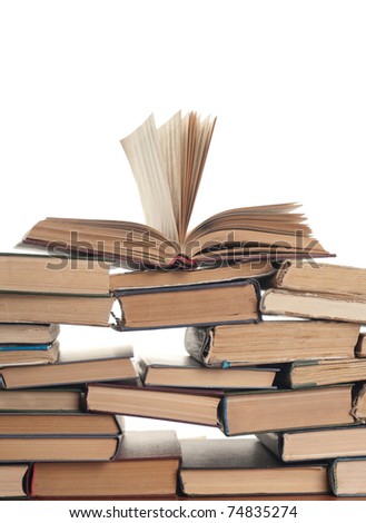pile of old books on a white background