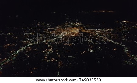 high over a city at night