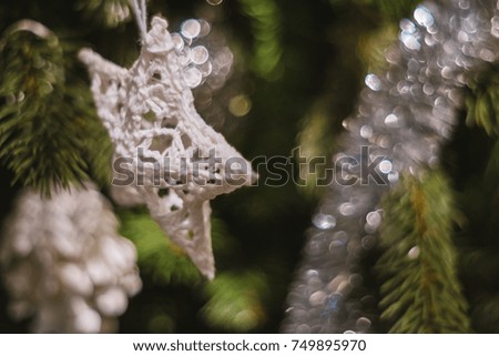 Soft focused on star made from fabric Christmas celebration accessories on Christmas tree prepare for the Christmas and happy New Year festival