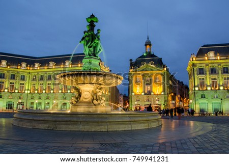 Green lights in the fountain of the Three Graces at la Bourse Place in the city of Bordeaux