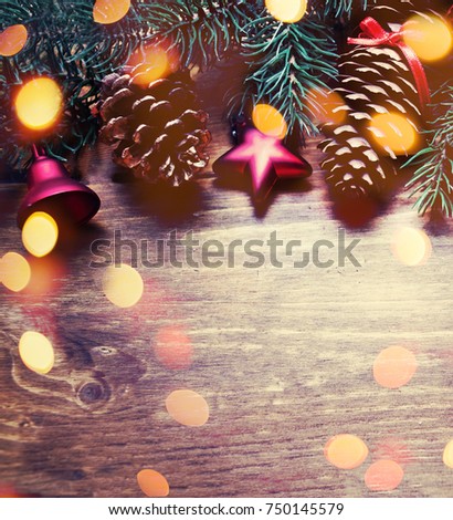Christmas composition with holiday decoration on dark wooden board in vintage style with copy space.  Flat lay, top view.

