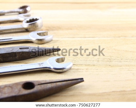 Construction tool concept of rust on brown wood background.Copy space.Selection focus.