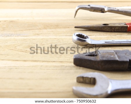 Construction tool concept of rust on brown wood background.Copy space.Selection focus.