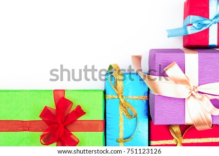 Big pile of colorful wrapped gift boxes isolated on white background. Mountain gifts.
