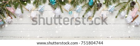 Merry Christmas and Happy New Year. Christmas Card Festive with green Fir Branches and Holiday Object on white Background. snowflakes