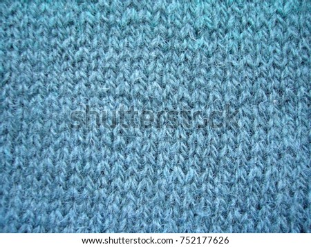 Texture of woolen jersey. Woolen fabric.