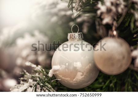 Defocus beautiful white background. decorations on a Christmas tree and glare of lights