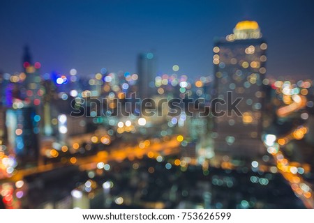Night aerial view blurred bokeh city downtown skyline, abstract background