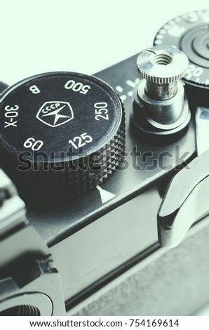 the adjusting ring on the old camera on white background