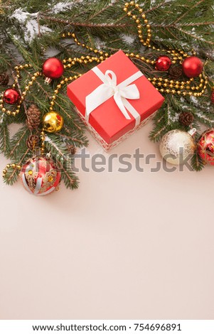 Christmas background with Christmas tree, Christmas balls and gift box. View with copy space. Happy New Year bauble traditional. Merry Xmas greeting card design element.