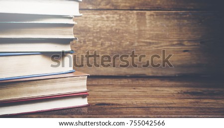 Vintage old books on wooden table background