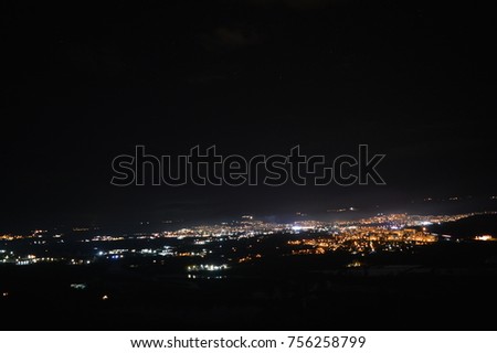 night lights of the city on a fog background in the sky and a stunning sensation