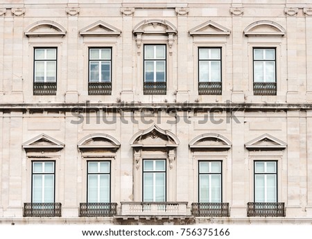 Facade of old apartment building with balconies.