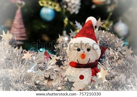 Christmas snowman decorations closeup closeup silver tinsel blur background