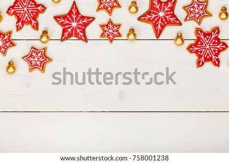 frame made of homemade christmas gingerbread cookies on white wooden background with copy space for text. holiday, celebration and cooking concept. new year and christmas postcard