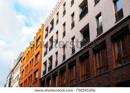 orange and white houses in a row