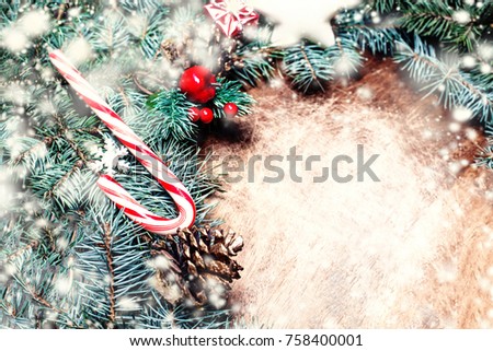Christmas wooden frame background with green  fir branches and xmas decorations with copy space.