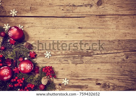 Christmas wooden background with snow fir tree and gift box. View with copy space