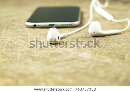  Headphone on wooden background