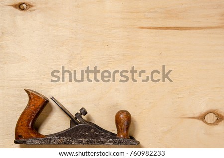 a plane  lay on a sheet of plywood. flat view. place for text.