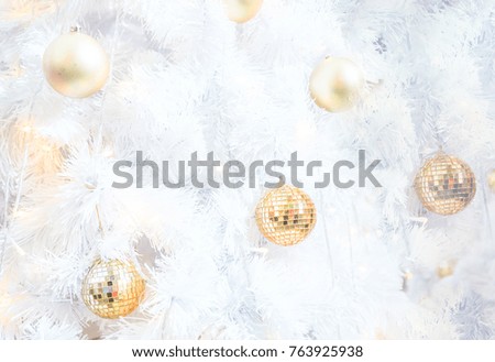 Shiny golden ball decorated on white Christmas leaf background  for Xmas  festival