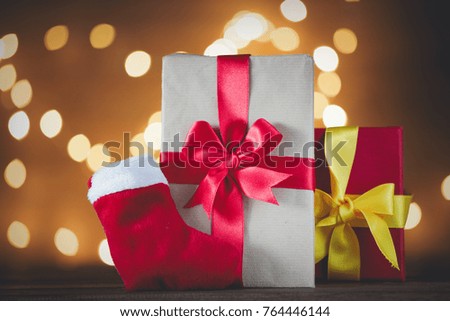 Christmas gifts and sock on Fairy Ligths background