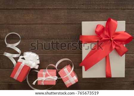 gift boxes of present for new year, christmas, birthday or anniversary on wood background. top view