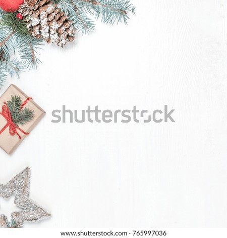 Christmas background with holiday decoration elements, presents  and fir tree branches on white wooden background. Christmas Flat lay  and top view composition with border and empty copy space 
