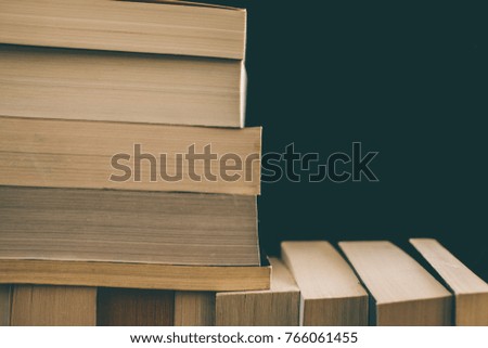 Books background. Old vintage books background. Education and knowledge, learn, study and wisdom concept. Stack of old books. Old books on a shelf, 