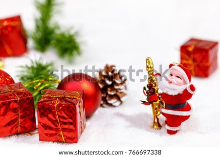 Santa Claus dolls and Christmas decorations box on White background with copy space