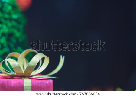 Christmas and Newyears celebration concept with gift box and Christmas tree with copy space