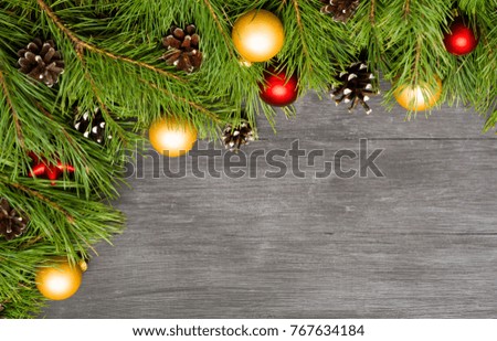 Christmas decoration, garland frame background, top view with copy space on black wood table