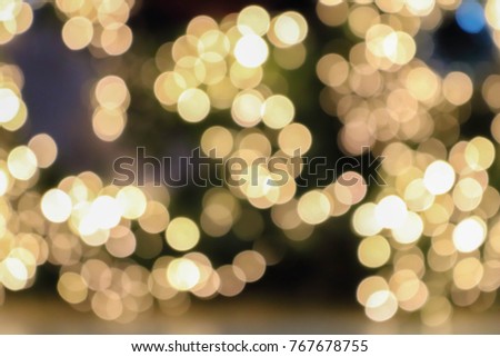 Bokeh pattern of light from the Christmas tree at night.