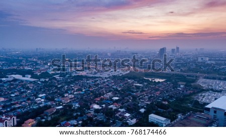 The background of the sky, violet, purple, pink, warm, sweet, romantic and happy mood. Sunset over town house Building and city