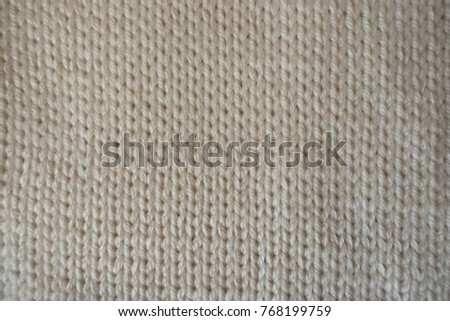 Cream handmade plain stockinette knitted fabric from above